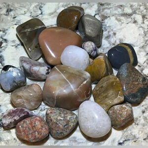 20 tumbled and polished rocks with container